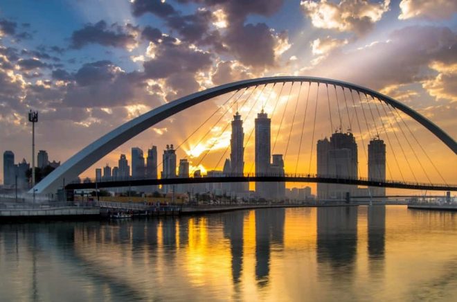 Dubai, UAE - March 4, 2017: Magical sunrise over Dubai Downtown as viewed from the Dubai water canal