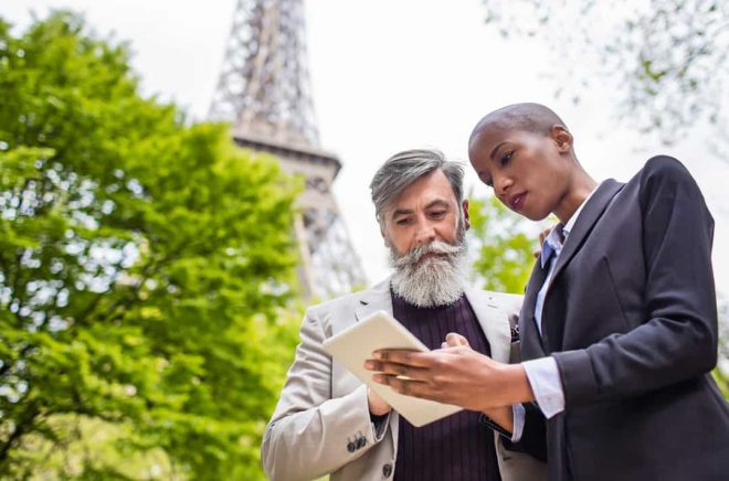 Business people talking in the streets of Paris.