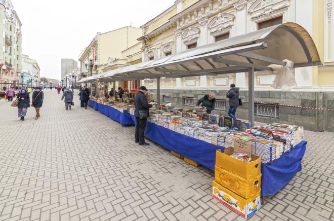 Moscow, Russia - March 17, 2014: Antique book sellers at Arbat street, famous touristic landmark in Moscow with lot of shops and traditional buildings